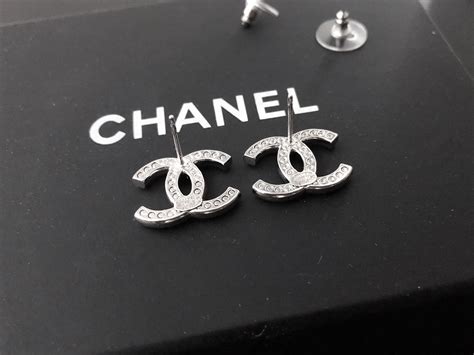 authentic chanel logo stud earrings.